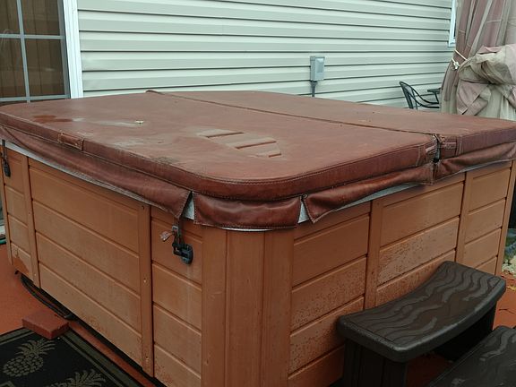 Relax in hot tub on patio.