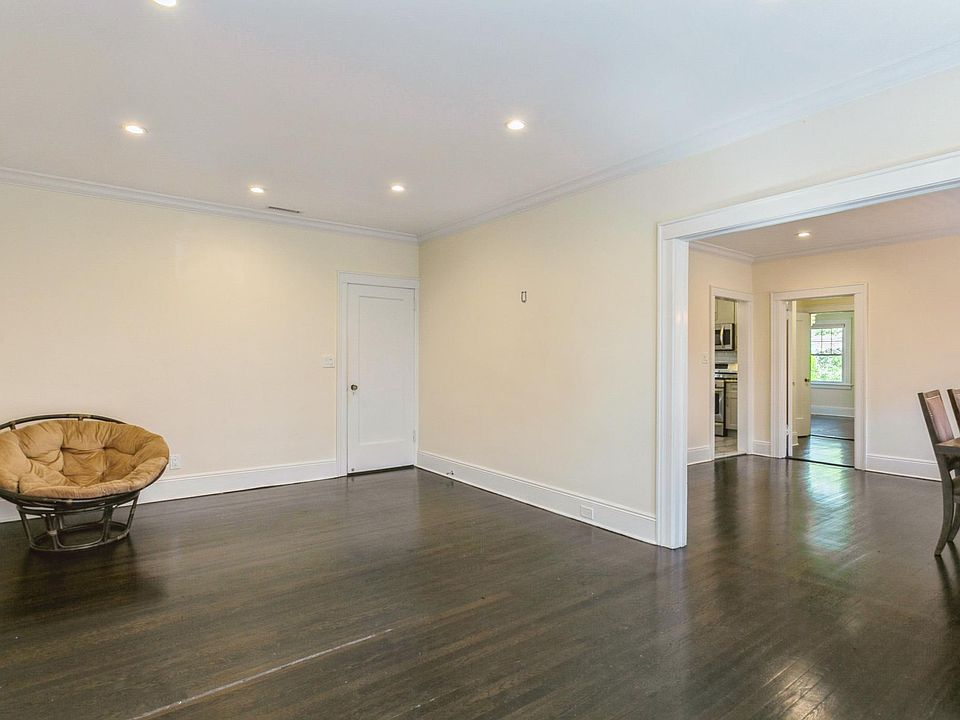 Living room with view of dining room. Shining hardwood floor.