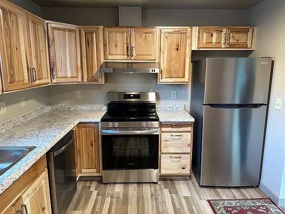 Kitchen with new cabinets, appliances and flooring.
