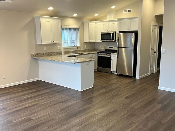 Vaulted great room with kitchen.