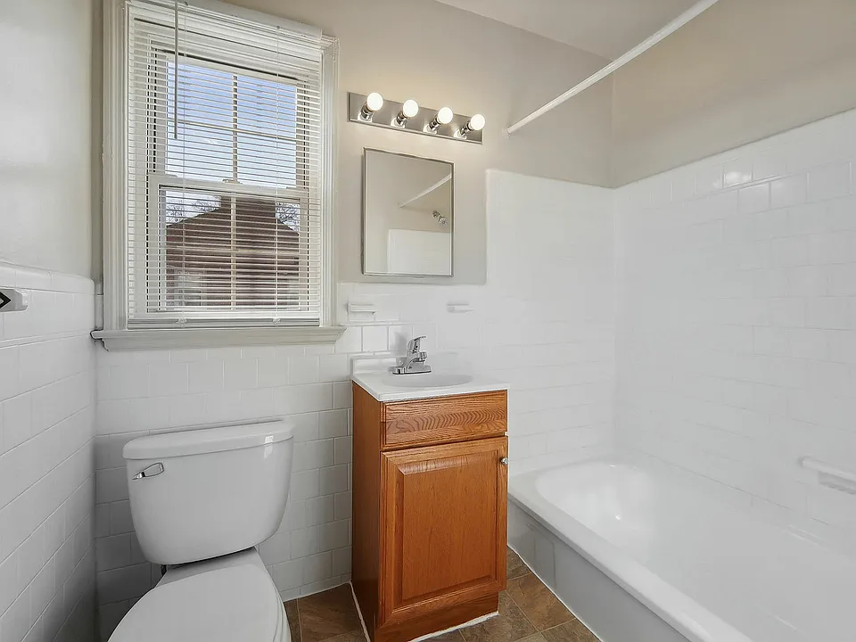 Immerse yourself in a fresh and airy bathroom that combines function with sleek design.