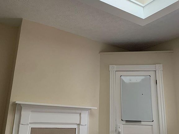 Bedroom 1 skylight, fireplace and closet.