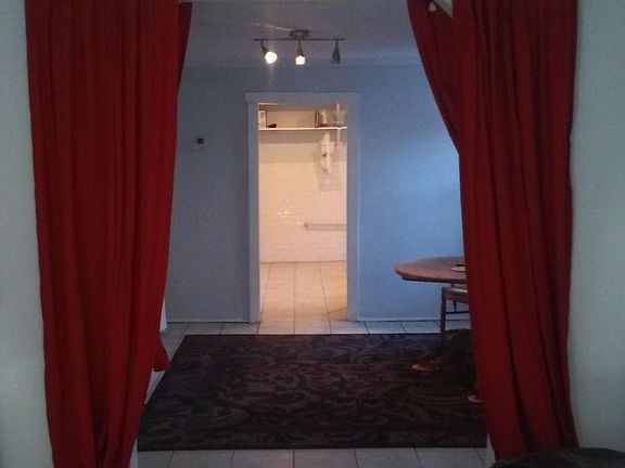 Looking from front room to kitchen. Middle room has double closet.