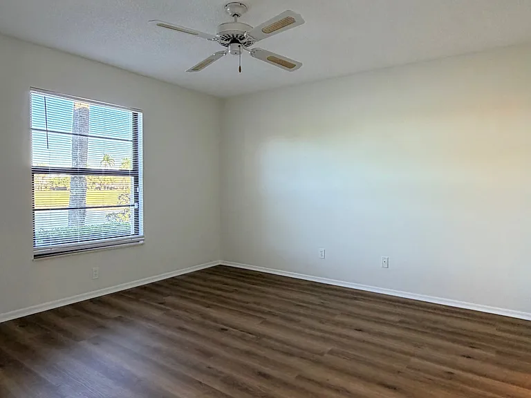 Spacious Primary Bedroom w/ stunning lake/golf views!