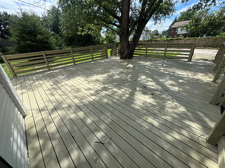 Huge, tree-shaded backyard deck!