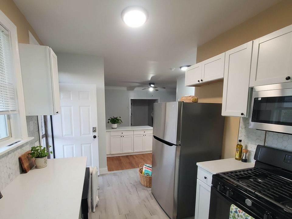 Modern kitchen with stainless steel appliances and durable flooring. Open layout with excellent storage and workspace.