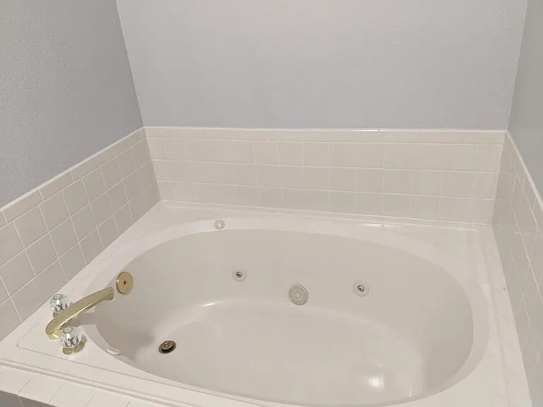 Private deep soaking bathtub in Primary ensuite bathroom