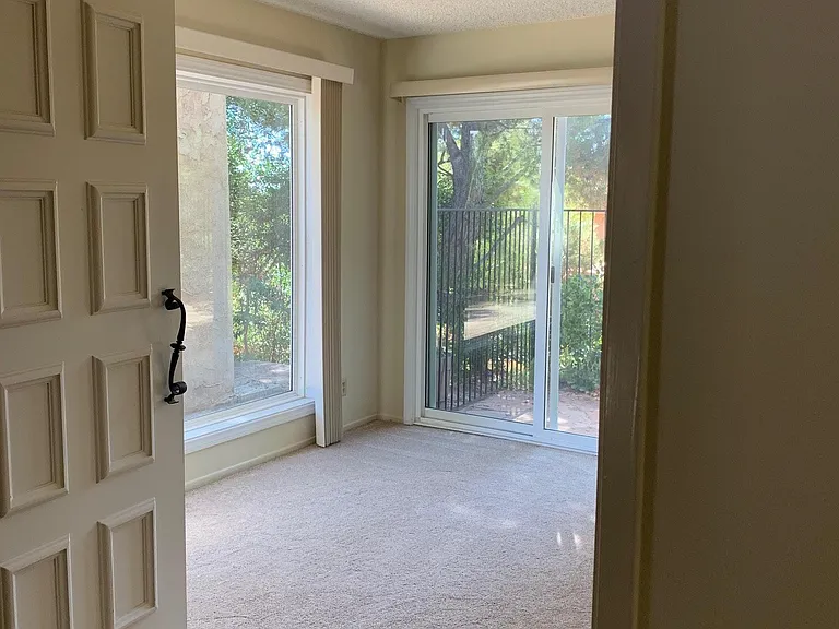 Additional room off entry provides space for an office or den and has private access to side patio.