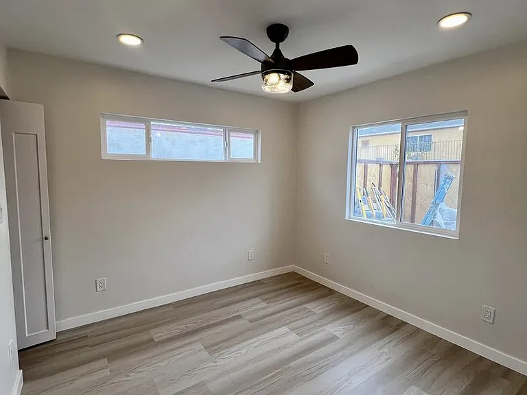 right bedroom with ceiling fan