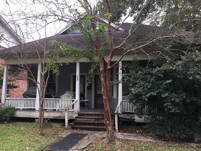 This front porch extends around to the right providing lots of room for rocking chairs and ice tea. Picture this porch with your own decorations and sunny days. Current tenant will remove all items as soon as a contract has been executed.