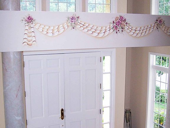 A Grand Volume Ceiling Foyer Entry...