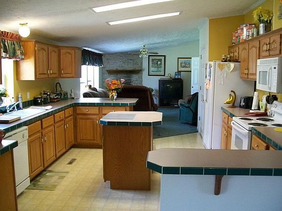 View from dining room into kitchen and family room