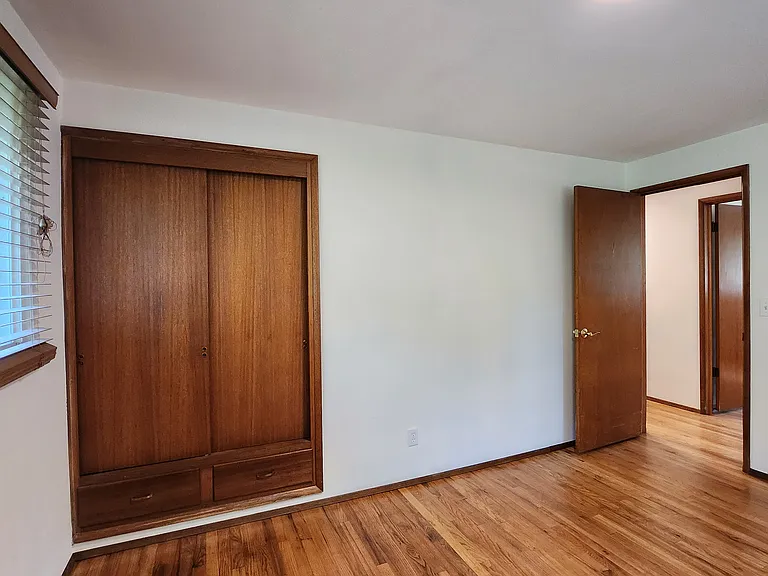 Bedroom 2: Second built in, and across from primary suite.