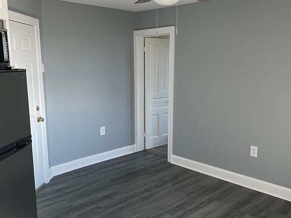 Living Room, from kitchen (see front door to left, bedroom door straight ahead)