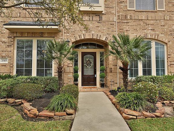 As you approach the front door, notice the symmetrical treatment which sets an elegant tone of welcome.