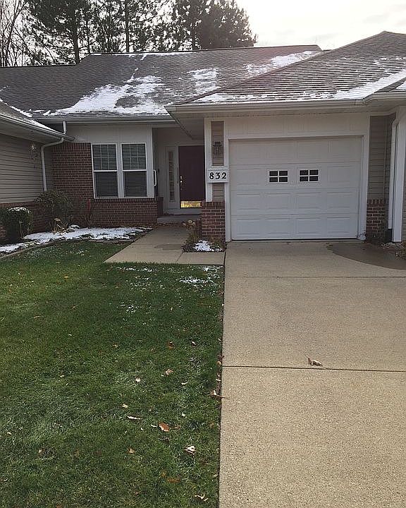 Front door, driveway, garage