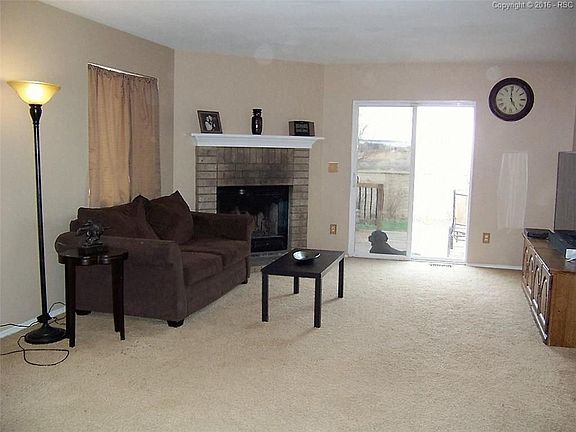 LIVING ROOM WITH WOOD BURNING FIREPLACE
