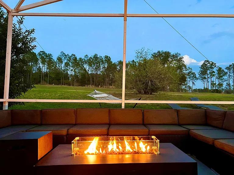 Outdoor Dining - Host exclusive private chef dinners for up to 24 guests outside and 20 inside, complemented by Philip Starck designed chairs. Enjoy scenic views of the private pool, golf course, and unwind by the Fire Pit with a cocktail.