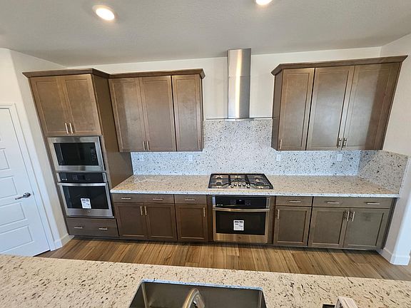 Brand new kitchen with granite countertops, stainless steel appliances