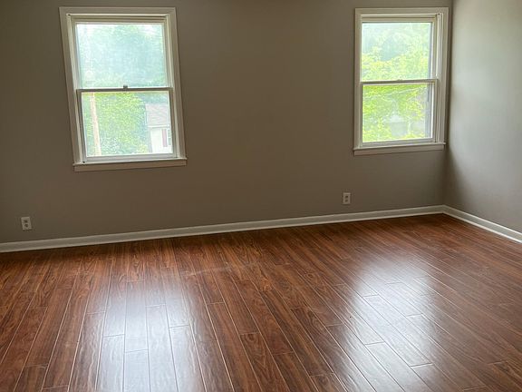 Large and light living room is open to the kitchen