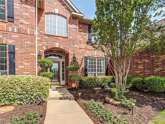 Covered front porch with etched glass front doors and sidelights. Full gutters. Beautiful landscape! This home has an excellent floor plan perfect for today's lifestyles.