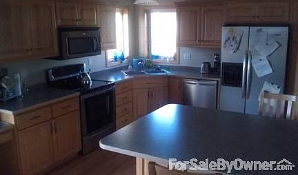 Kitchen
						:
						Big open kitchen with large island and stainless appliances