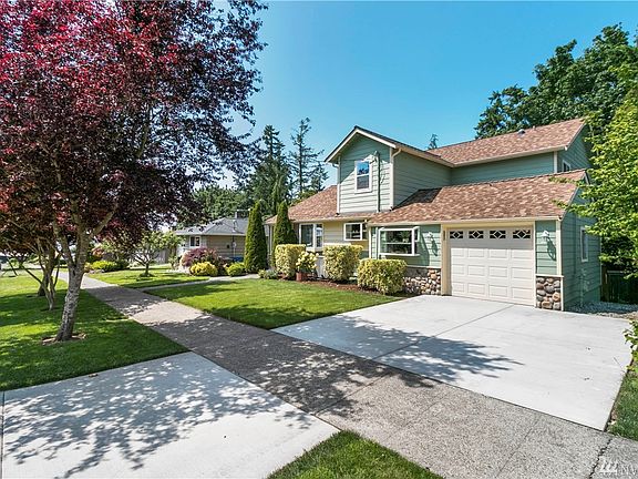 Gorgeous front yard welcomes you to your new home and look at that off street parking.  