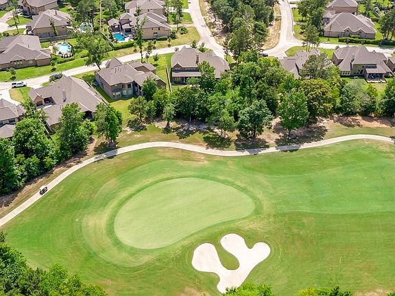 The 13th green of Woodforest is behind home.