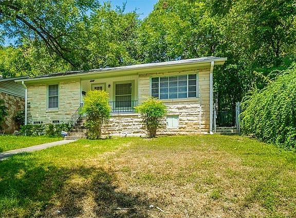 Situated upon a slight hill on quiet street.