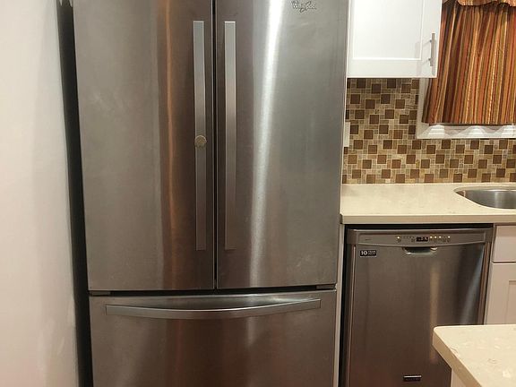 Refrigerator and Dishwasher in Kitchen