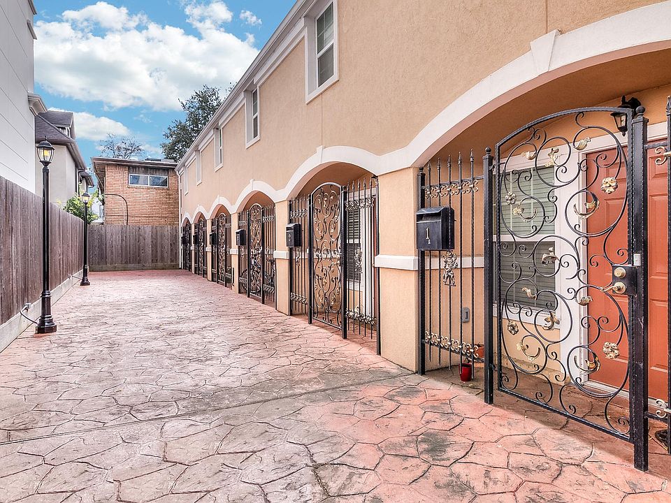 Stamped concrete pathway to gated entry