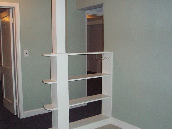 Kitchen flows to hall, living room