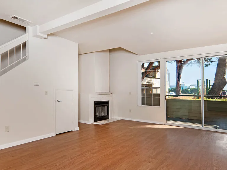 Living Room with Hard Surface Flooring, Fireplace and Patio