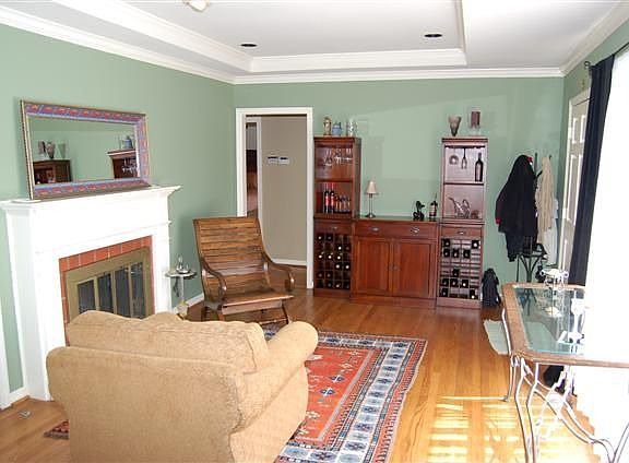 FORMAL LIVING ROOM WITH FIREPLACE AND HARDWOOD FLOORS