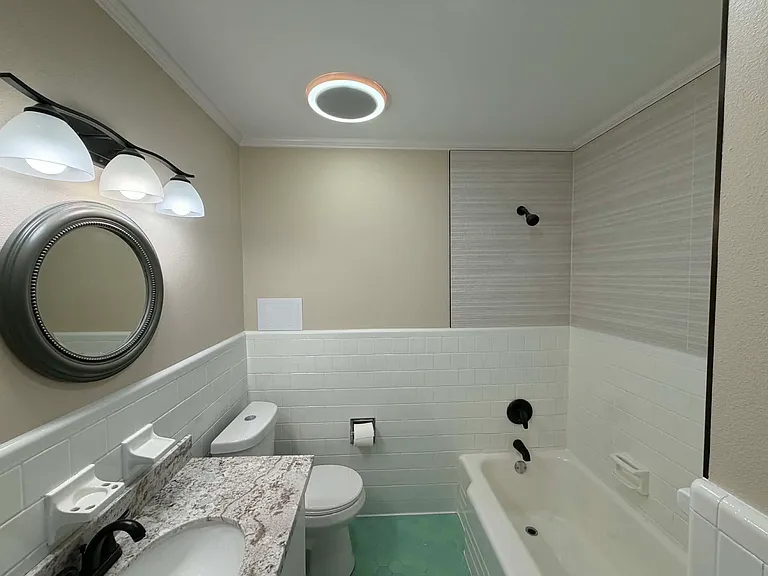 Hall bathroom new and reglazed tile
Bluetooth light with speaker