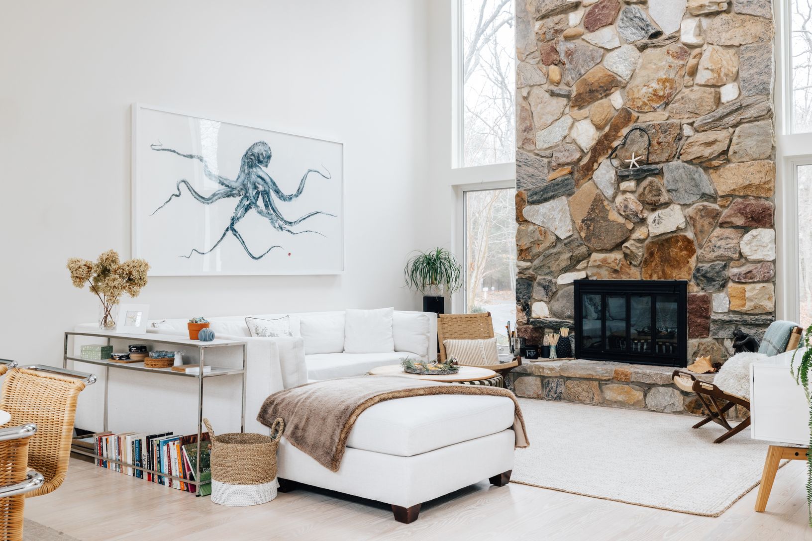  Triple height living room with wood burning fireplace