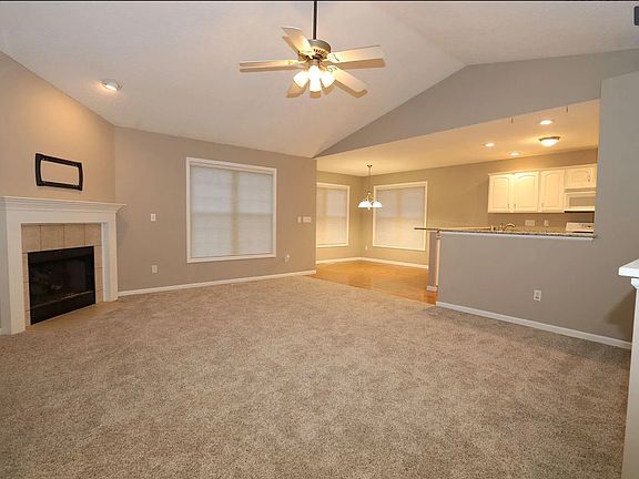 Living Room to the Dining Area and Kitchen.