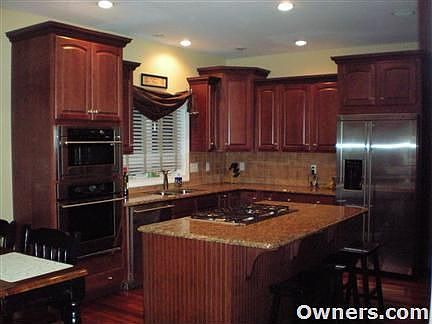 Custom kitchen with Grantite tops and Monogram Appliances