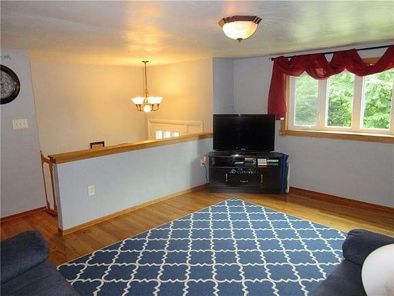 The living room overlooks the entry and leads down the hall to the kitchen/dining rooms and the bedrooms!