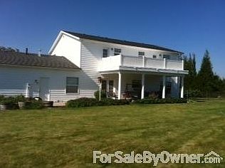 Back view of house, patio, deck and yard