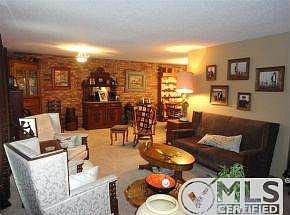 Living room with brick wall