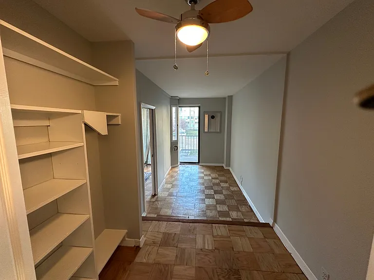 View from dressing area on upper level, and step down to bedroom.