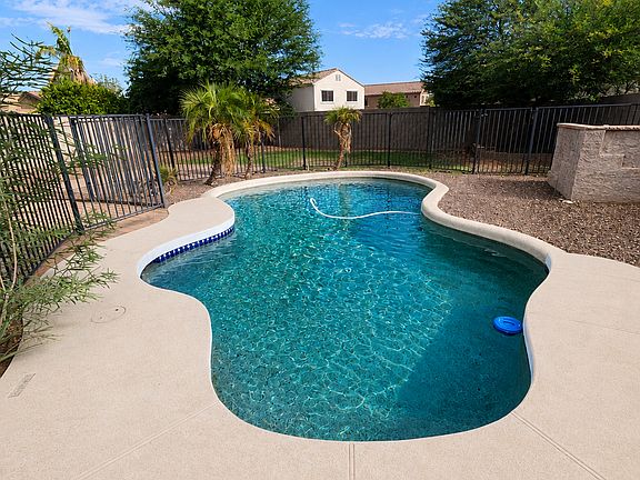 Pool with iron fence all around. Pool maintained by owner, included in rent.