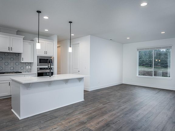 Dining room has view of backyard and open space