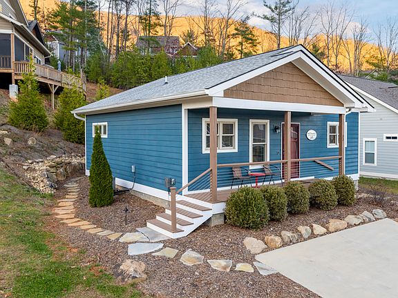 "Little Blue" has extensive stonework and landscaping with no maintenance to you!