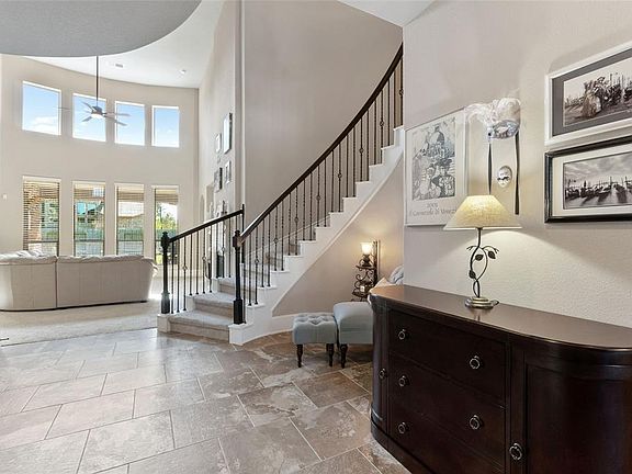 Views of wrought iron staircase as you enter