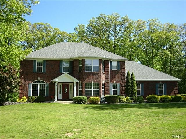 Estate style 2 story home on private, wooded 3 acre culdesac lot