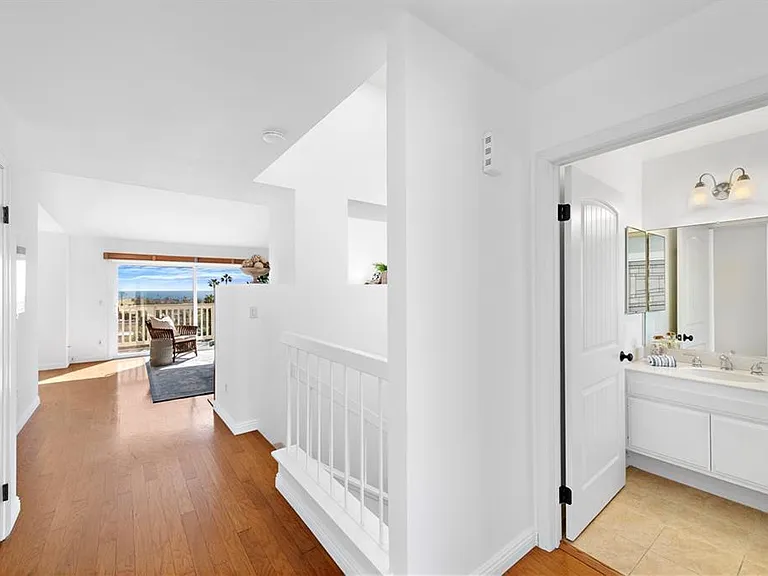 view from entry, half bath on the right