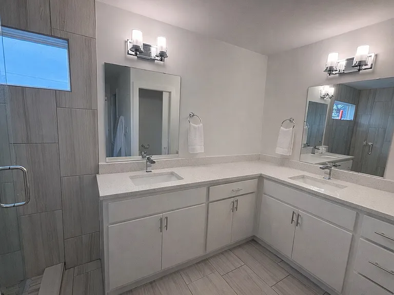 Double-vanity primary bathroom with contemporary design
