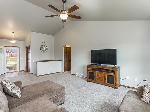 Open to Foyer with Custom Tile and Half Bath